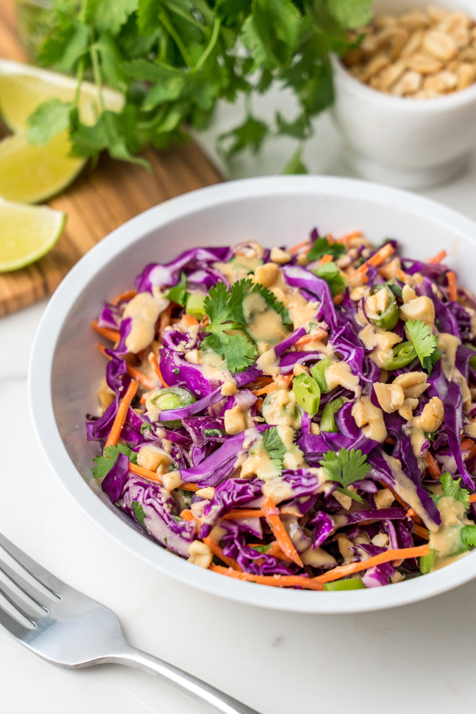 Bowl of Purple Cabbage Salad with Thai Peanut Dressing