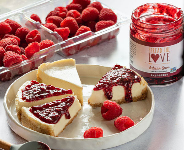 Slices of Raspberry Cheesecake with Spread The Love Raspberry Jam