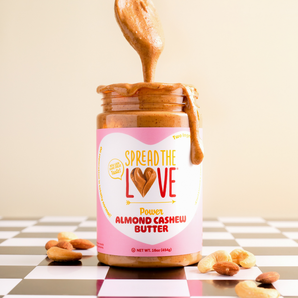 
                  
                    Load image into Gallery viewer, Spread The Love ALMOND CASHEW Power Butter with drizzle down the side and spoon in the jar. 
                  
                