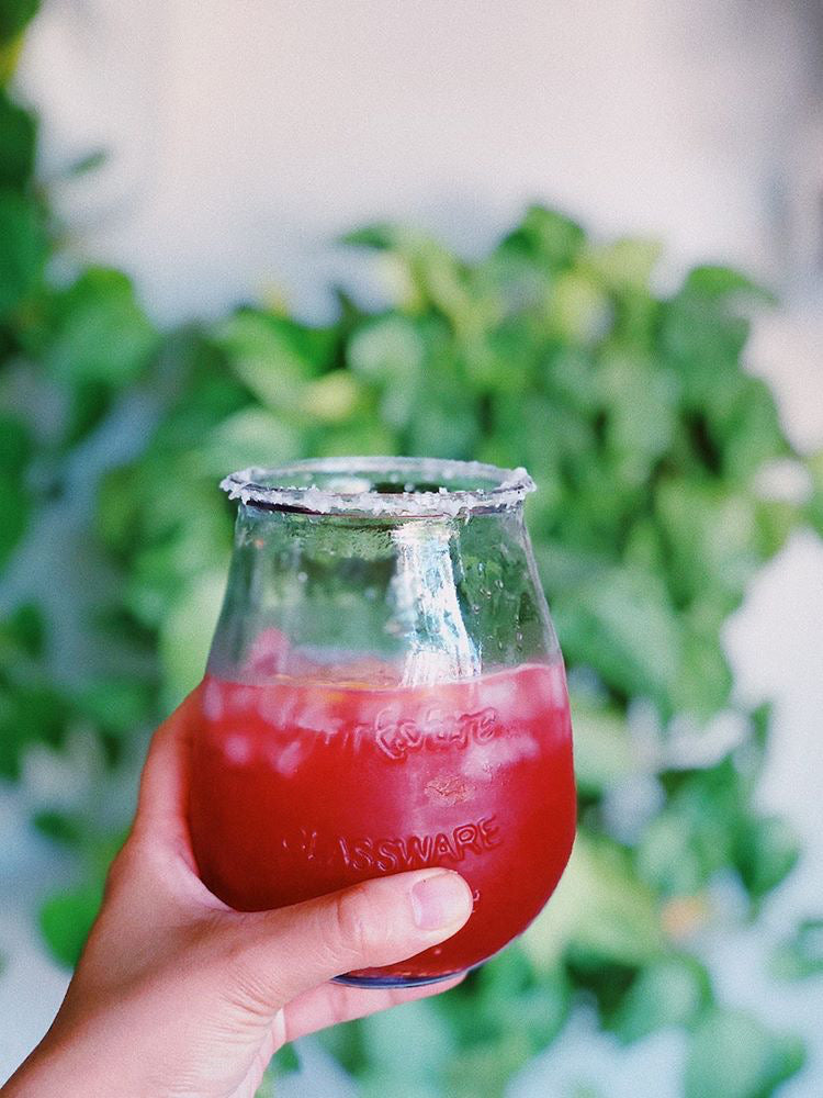Glass of Raspberry Jam Margarita with a salt rim