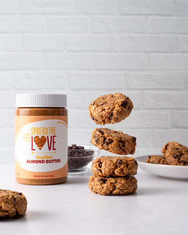 Oatmeal Almond Butter Cookies next to Spread The Love Almond Butter jar