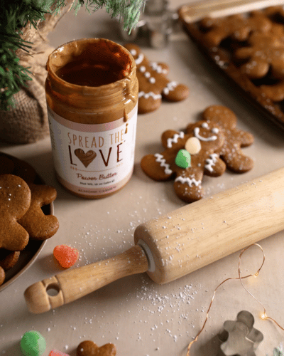 Decorated Almond Cashew Gingerbread Cookies with Almond Cashew Power Butter Jar and rolling pin