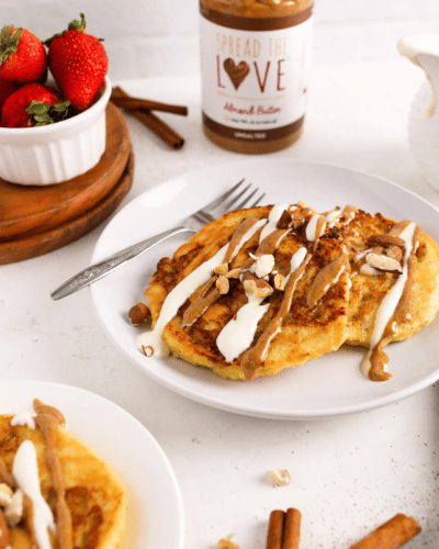 Plate of Cinnamon Roll Pancakes next to Almond Butter jar