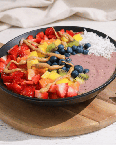 Rainbow Superfood Smoothie Bowl with jar of Almond Cashew Butter
