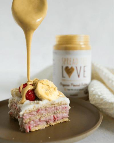 Slice of Raspberry Icebox Cake with drizzle of peanut butter