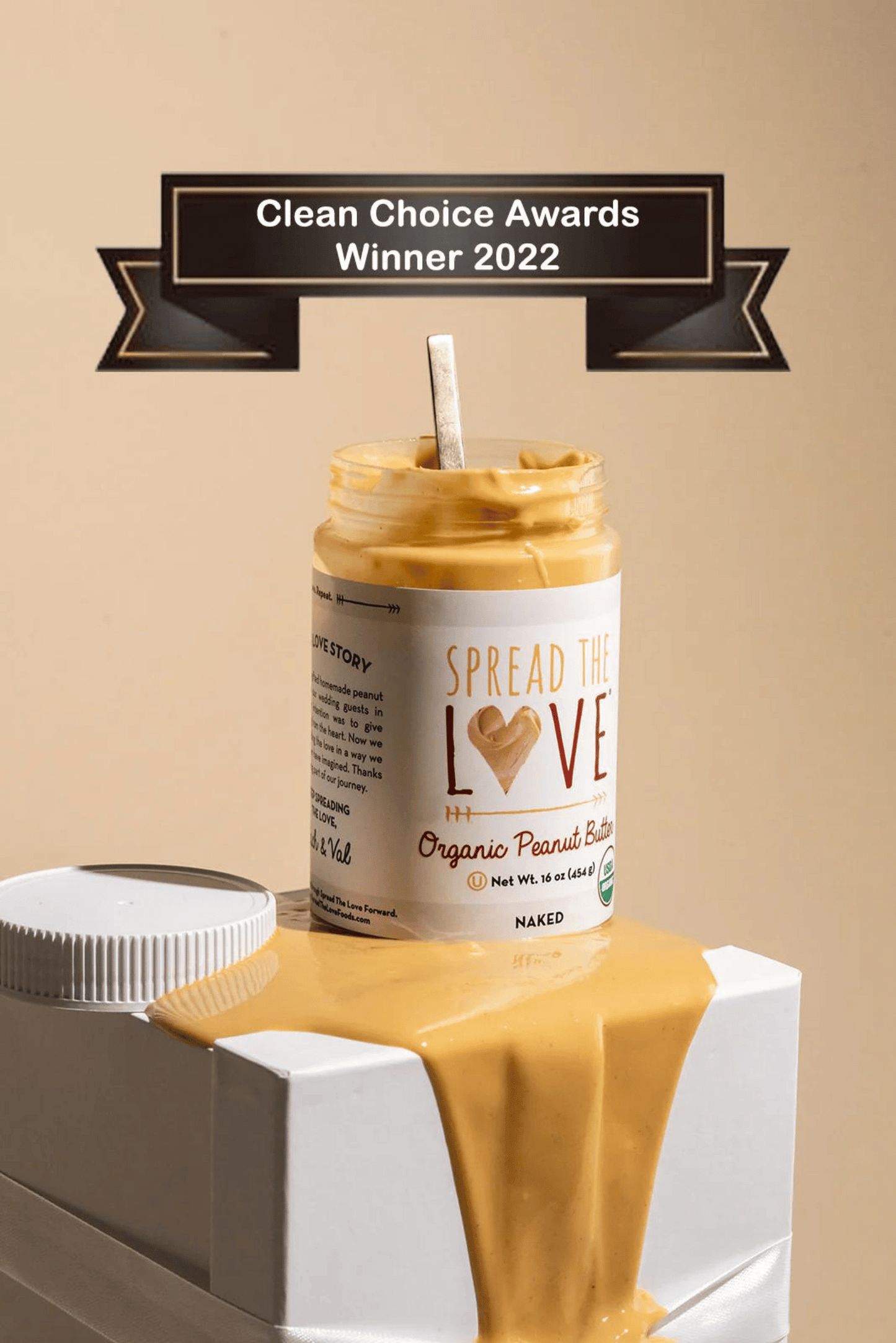 Jar of NAKED Organic Peanut Butter showing 2022 Clean Choice Award Winner tag