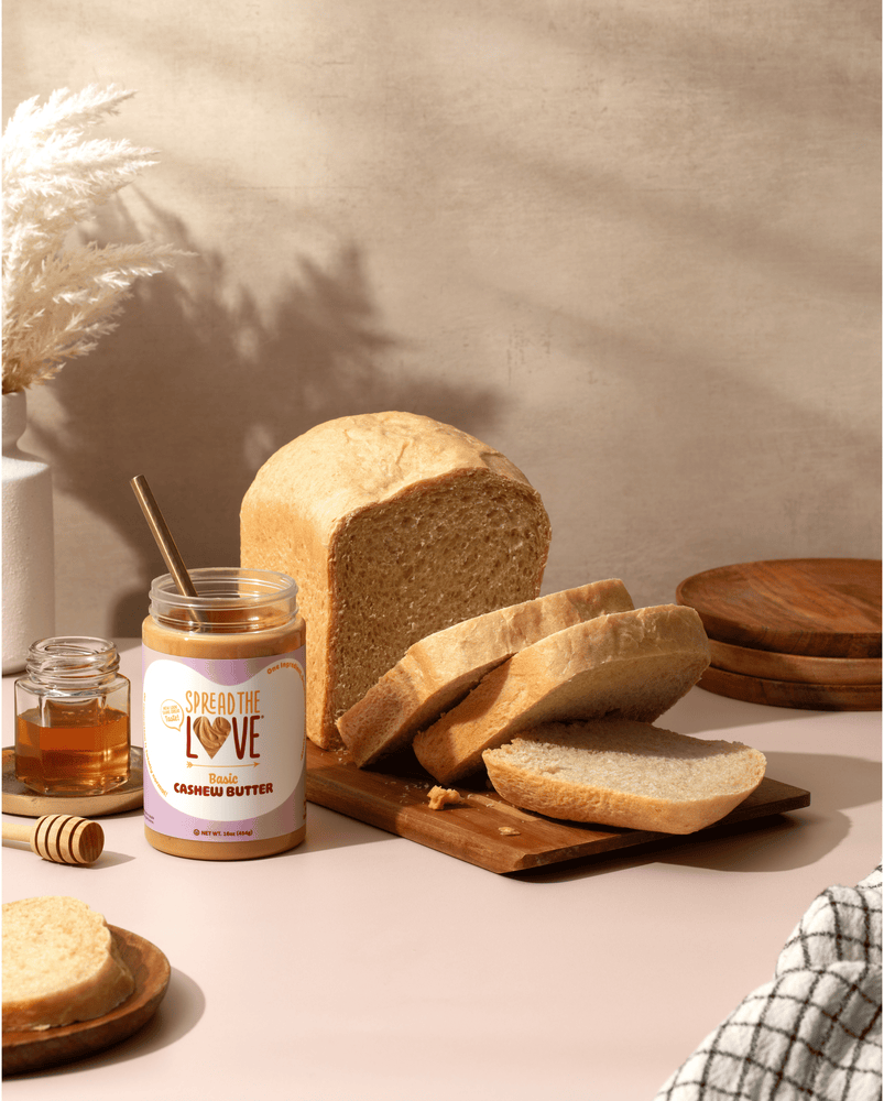 Cashew Butter jar next to loaf of bread