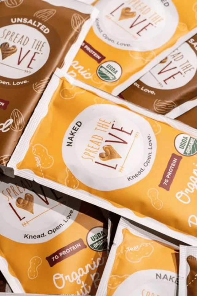 Photo of a pile of Spread The Love Peanut Butter and Almond Butter packets.
