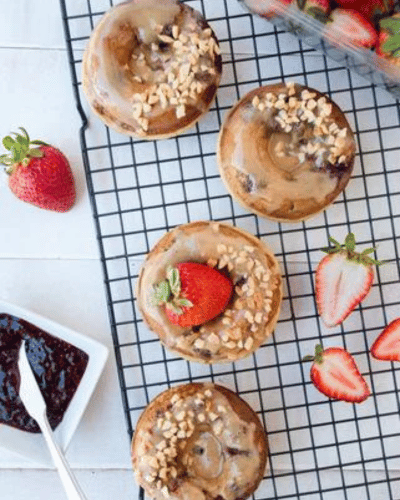 Rack with four Peanut Butter and Jelly Baked Donuts