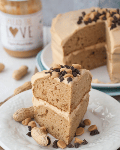 Slices of Triple Peanut Butter Cake topped with Chocolate and Peanut Butter Chips