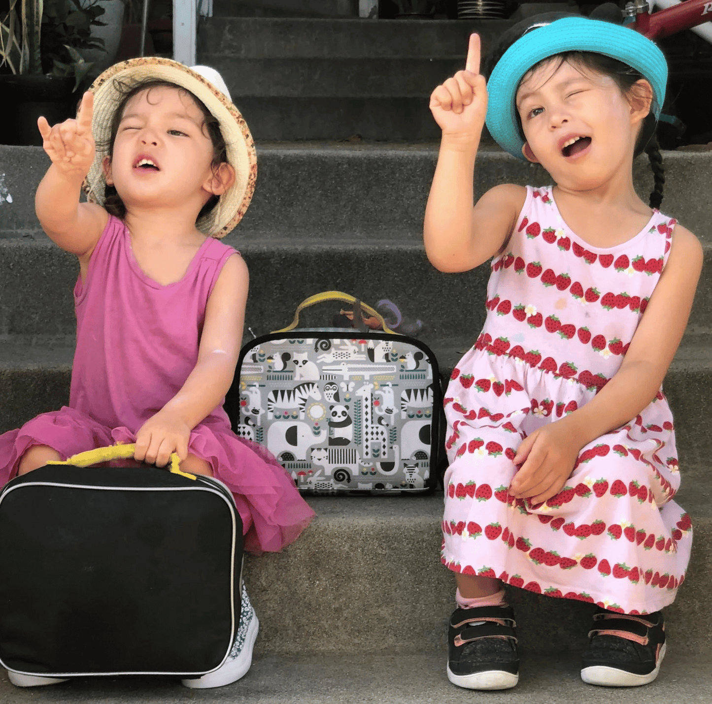 Taj and Tala with their lunchboxes
