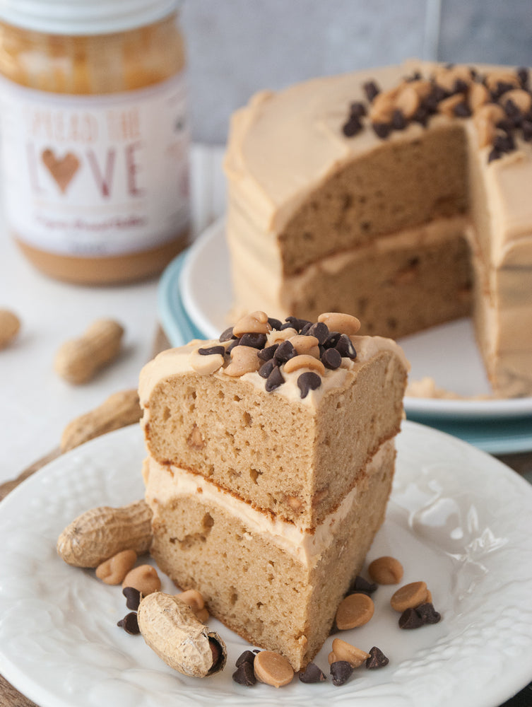 Slices of Triple Peanut Butter Cake topped with Chocolate and Peanut Butter Chips