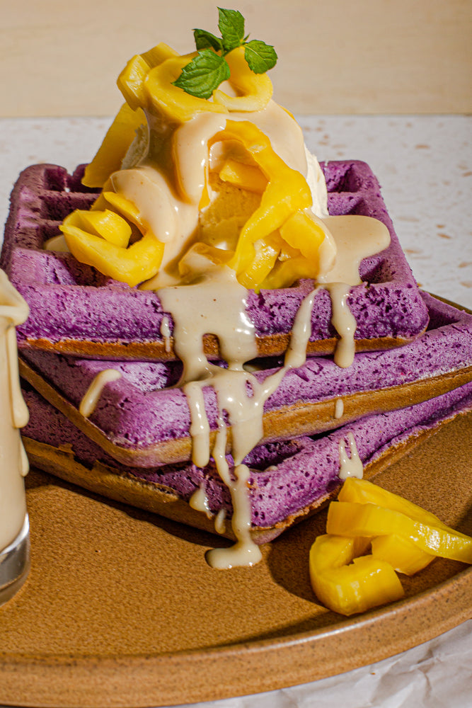 Plate of Ube Waffles with Cashew Coconut Sauce 