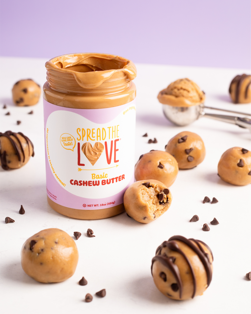 Spread The Love Cashew Butter jar surrounded by Chocolate Chip Cookie Dough Bites