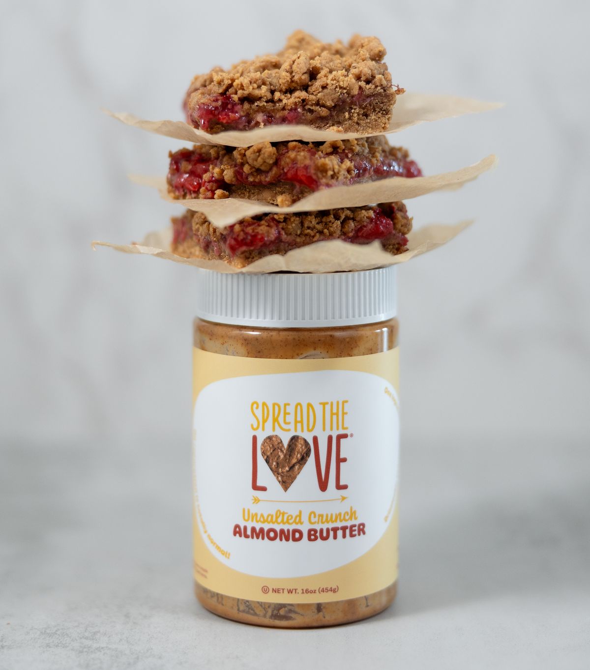 Almond Butter jar with treats on top
