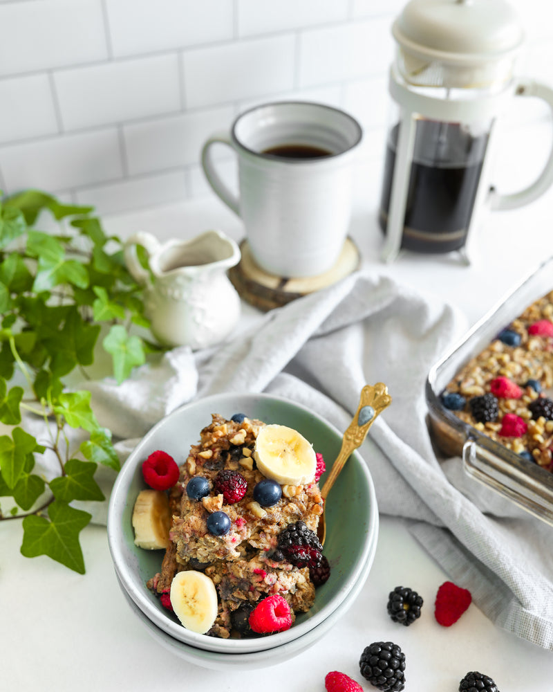 Bowl of Triple Berry Baked Oatmeal with Coffee and Coffee Press