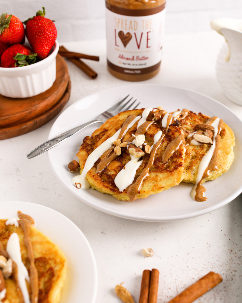 Plate of Cinnamon Roll Pancakes next to Almond Butter jar