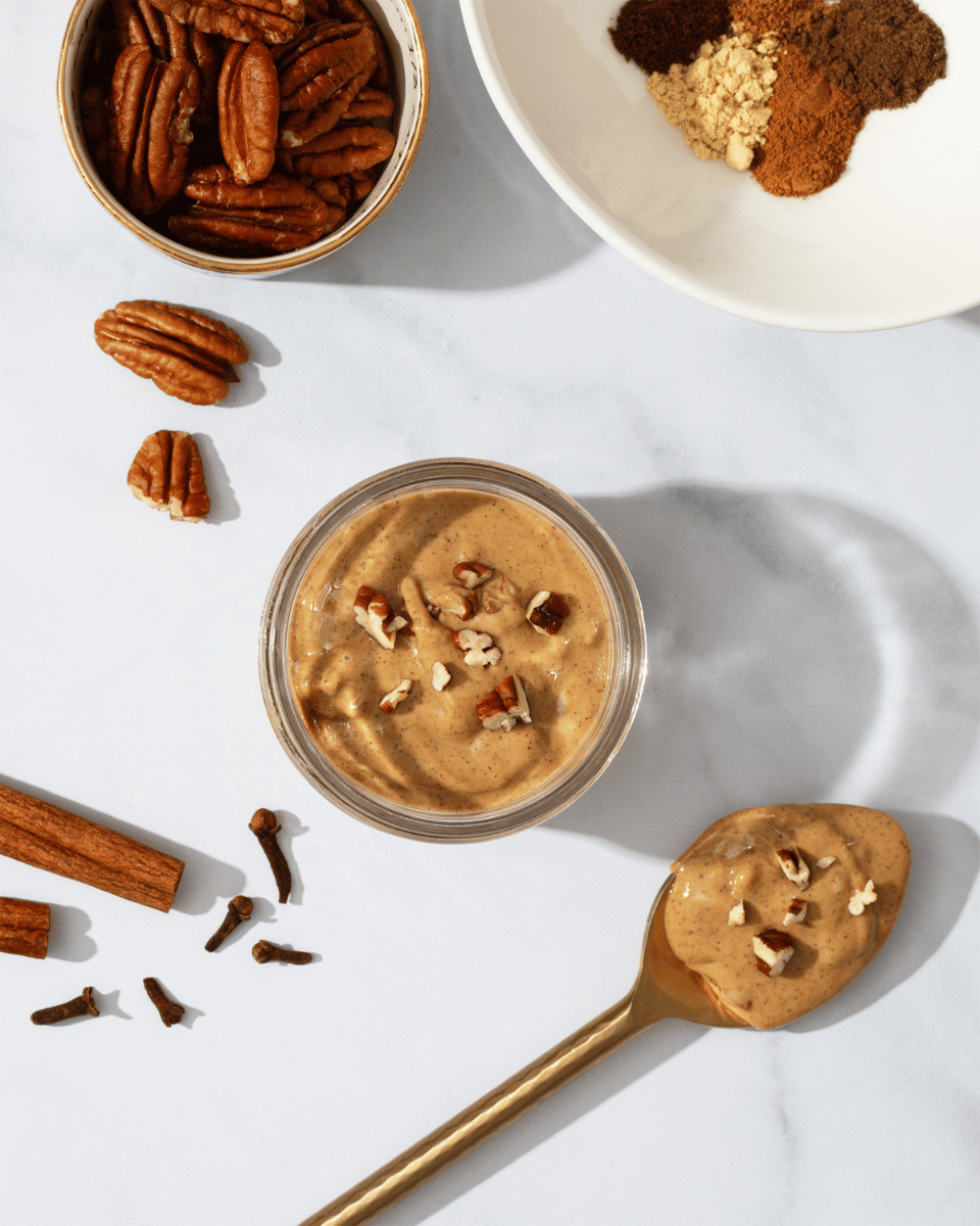 Caramel Apple and Gingerbread Pecan Cashew Butter in a bowl with spoonful