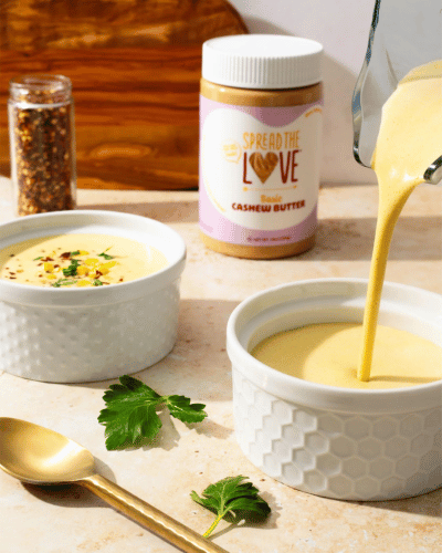 Creamy Cashew Corn Blender Soup being poured into bowl