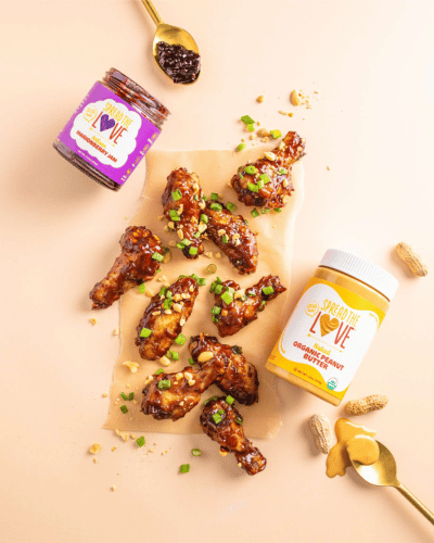 Table with Crispy Air Fryer PB&J wings with Marionberry Jam and NAKED Organic Peanut Butter
