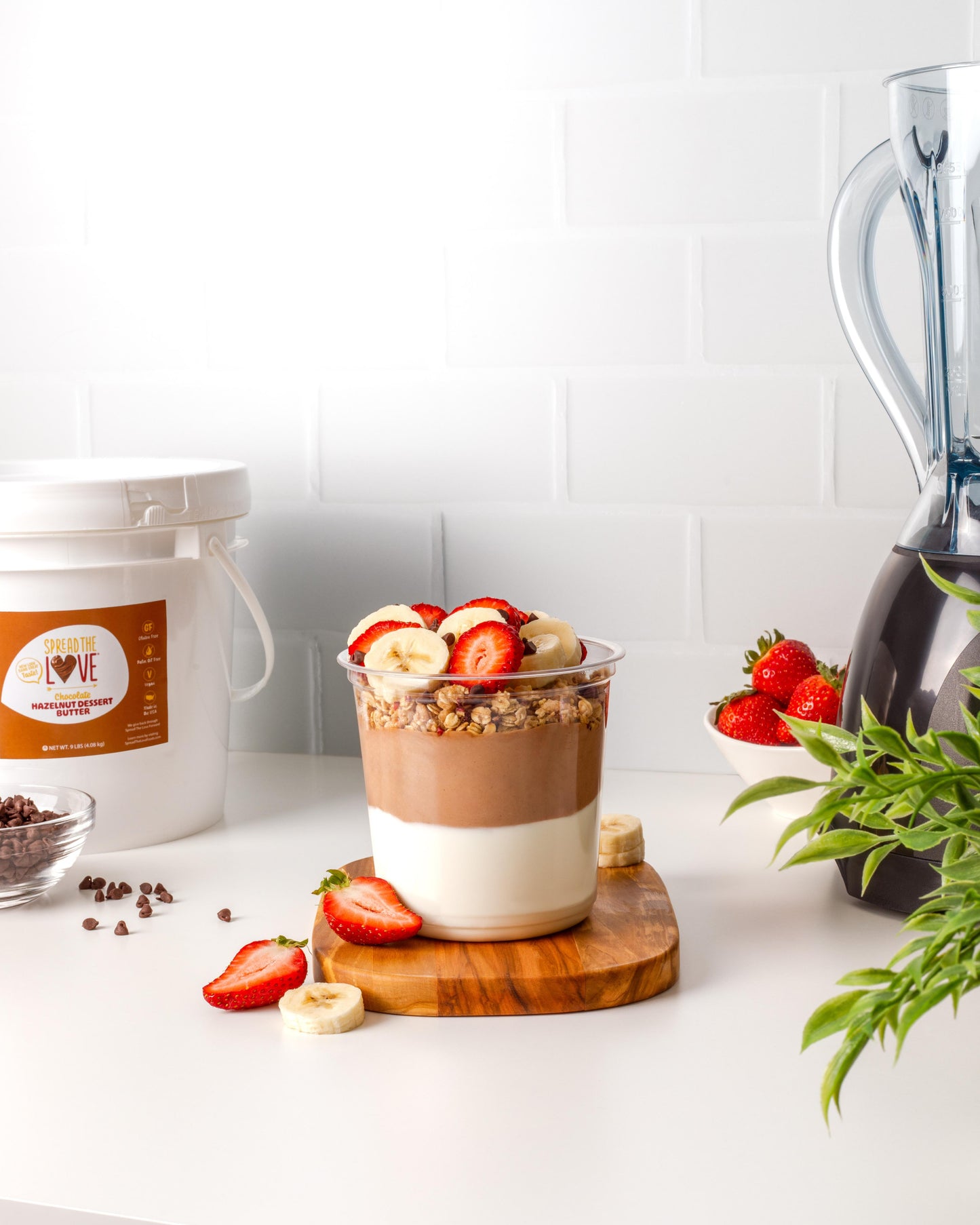 Smoothie Bowl with Spread The Love Chocolate Hazelnut Dessert Butter Pail in the background
