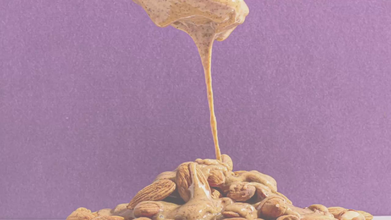 Almond Butter drizzling then jars of nut butters